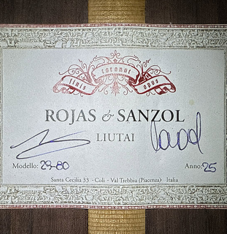 The label of a 2025 Rojas &amp; Sanzol "10-string" classical guitar made of cedar and Indian rosewood