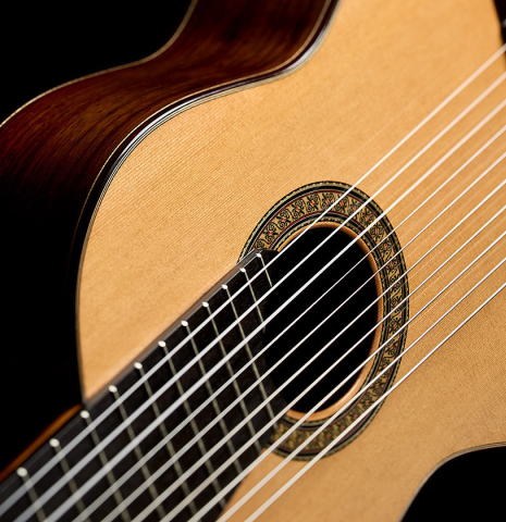 The soundboard of a 2025 Rojas &amp; Sanzol "10-string" classical guitar made of cedar and Indian rosewood