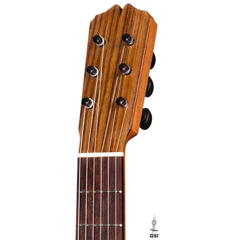 The headstock of a 2020 Pepe Romero &quot;Blanca&quot; flamenco guitar with traditional pegs made of spruce and cypress