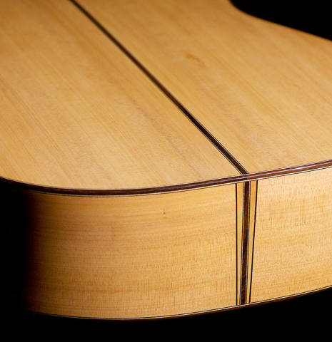 The back and sides of a 2020 Pepe Romero &quot;Blanca&quot; flamenco guitar with traditional pegs made of spruce and cypress