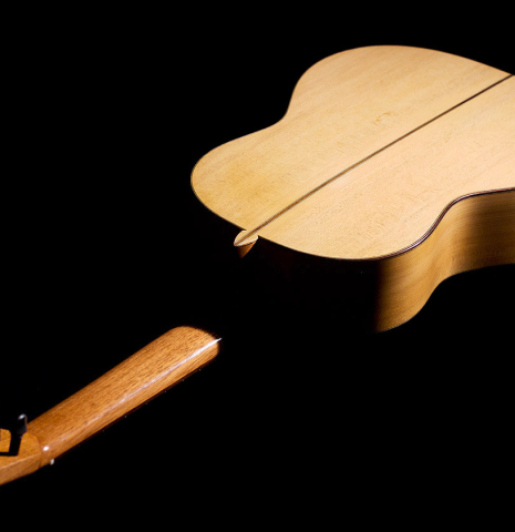 The back of a 2020 Pepe Romero &quot;Blanca&quot; flamenco guitar with traditional pegs made of spruce and cypress