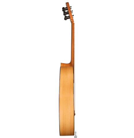 The side of a 2020 Pepe Romero &quot;Blanca&quot; flamenco guitar with traditional pegs made of spruce and cypress
