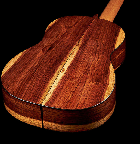 The back and sides at the foot of a 2024 Pepe Romero "Negra y Blanca" flamenco guitar made of spruce and CSA rosewood