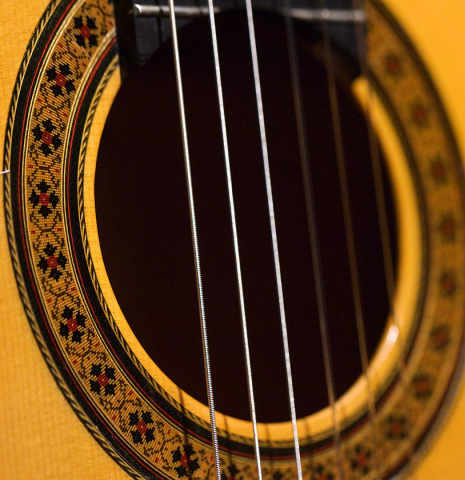 The rosette of a 2005 German Vazquez Rubio &quot;Almeria&quot; flamenco guitar made with spruce and cypress.