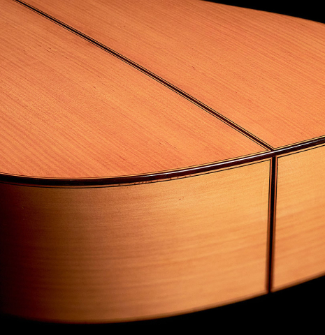 The side, binding and back made with cypress of a 2022 German Vazquez Rubio Concert Flamenco Blanca guitar