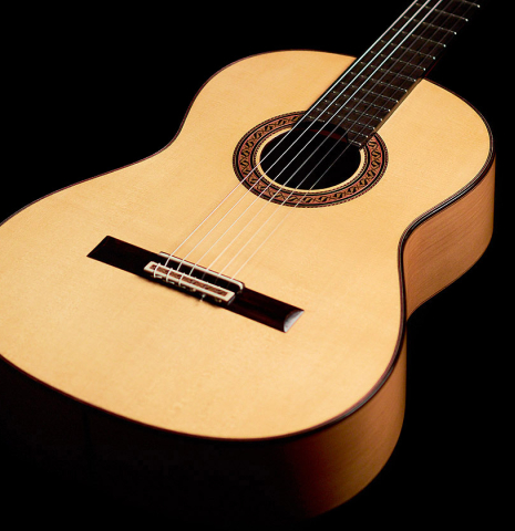 The front of a 2022 German Vazquez Rubio Concert Blanca Flamenco guitar made with spruce soundboard and cypress back and sides