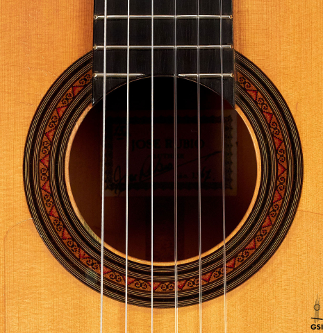 The rosette of a 1967 "Jose" David Rubio "Blanca" flamenco guitar with traditional pegs made of spruce and cypress