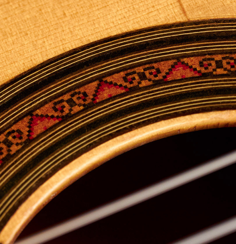The rosette of a 1967 "Jose" David Rubio "Blanca" flamenco guitar with traditional pegs made of spruce and cypress