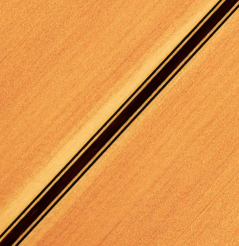 The back of a 1997 German Vazquez Rubio flamenco guitar made with spruce and cypress