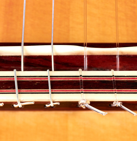 The bridge and saddle of a 2010 Tomatito "La Chanca" (AFP) flamenco guitar made of spruce and cocobolo