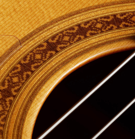 Closeup detail of the rosette of a 2009 Tomatito "La Chanca" flamenco guitar made of spruce and cypress