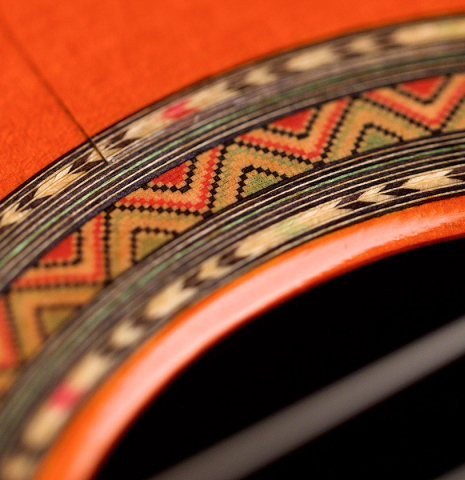 A close-up of the rosette of a 1996 Conde Hermanos &quot;AF 25&quot; flamenco guitar made with spruce and Indian rosewood