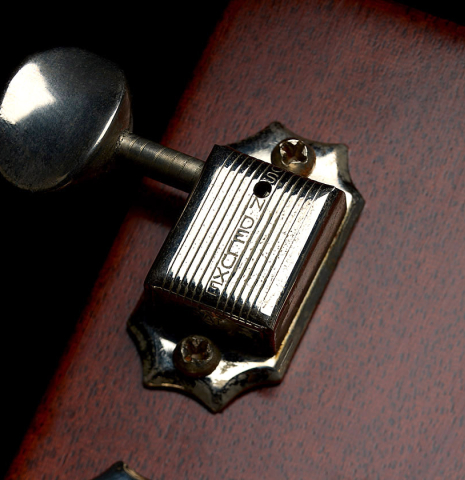 The tuning mechanism of a 1951 Martin D-18 steel-string guitar made of spruce and mahogany