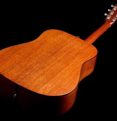 The back and sides of a 1951 Martin D-18 steel-string guitar made of spruce and mahogany