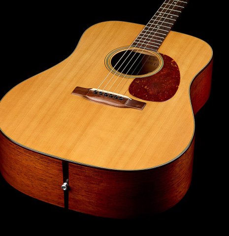 The soundboard, sides and endpin of a 1951 Martin D-18 steel-string guitar made of spruce and mahogany