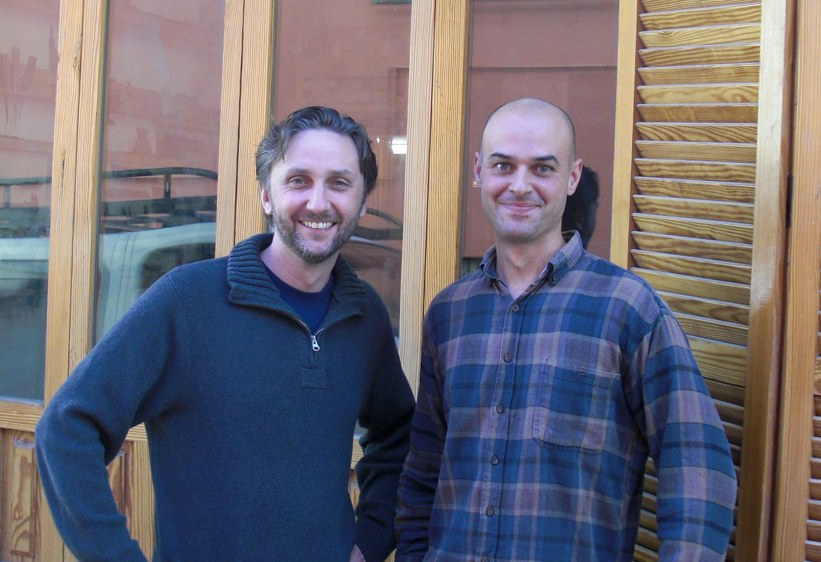 David and _____, standing in front of his workshop.
